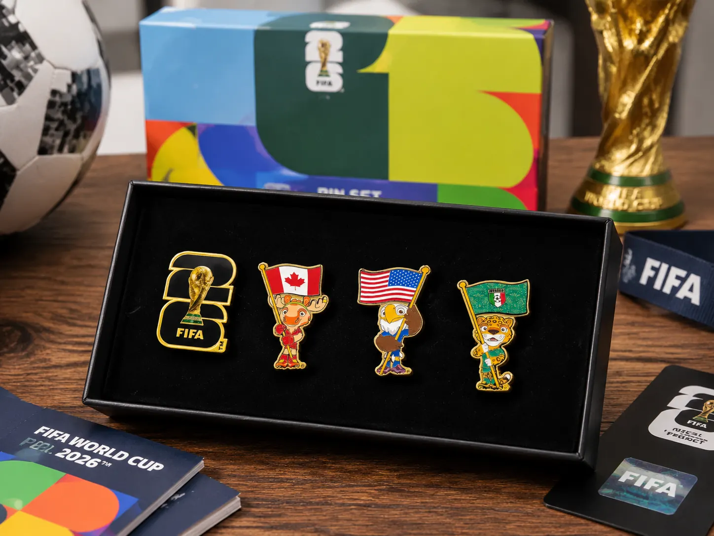 Four FIFA World Cup 2026 collectible pins displayed in a black presentation box